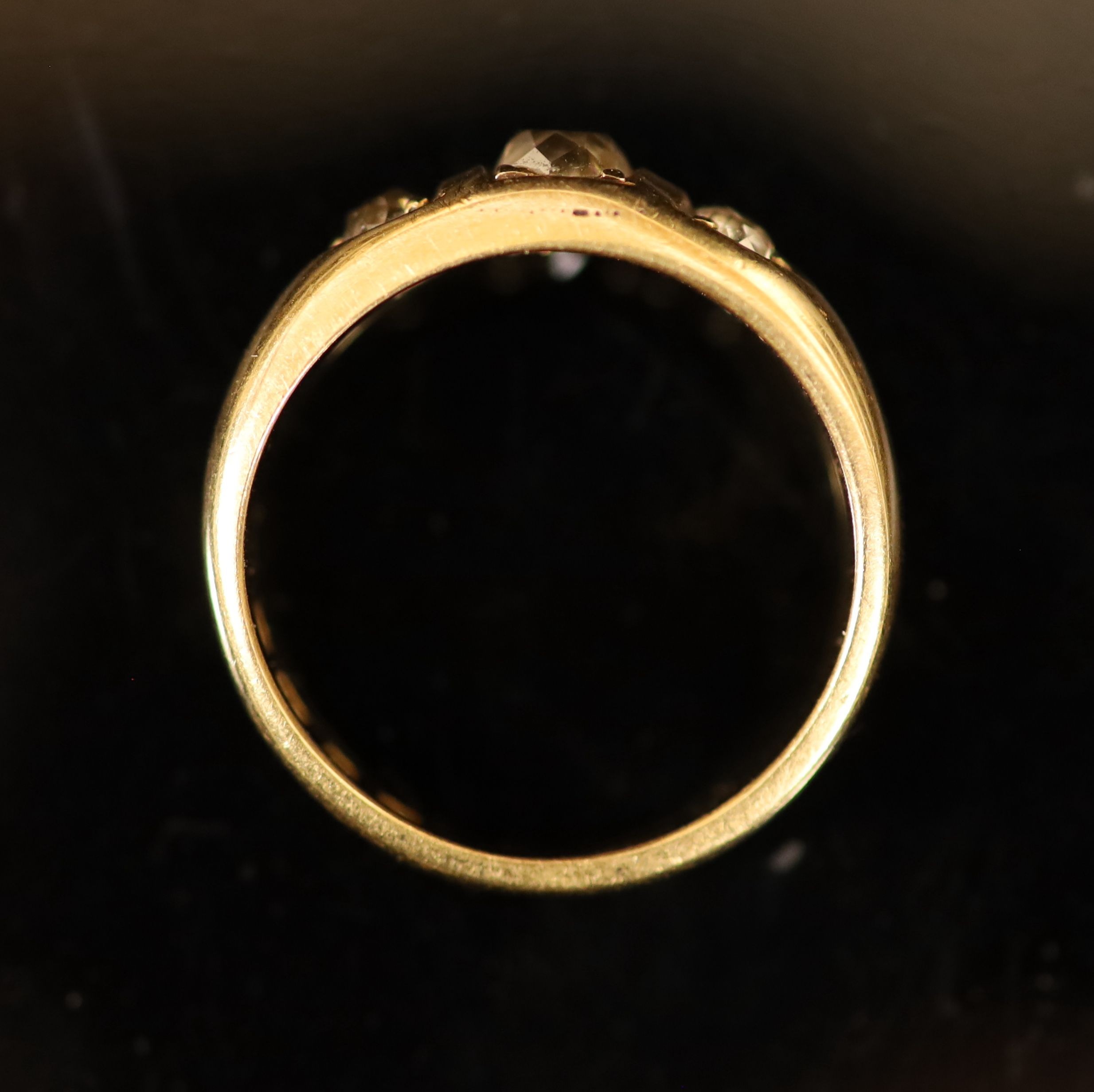 A George V 18ct gold and three stone diamond ring